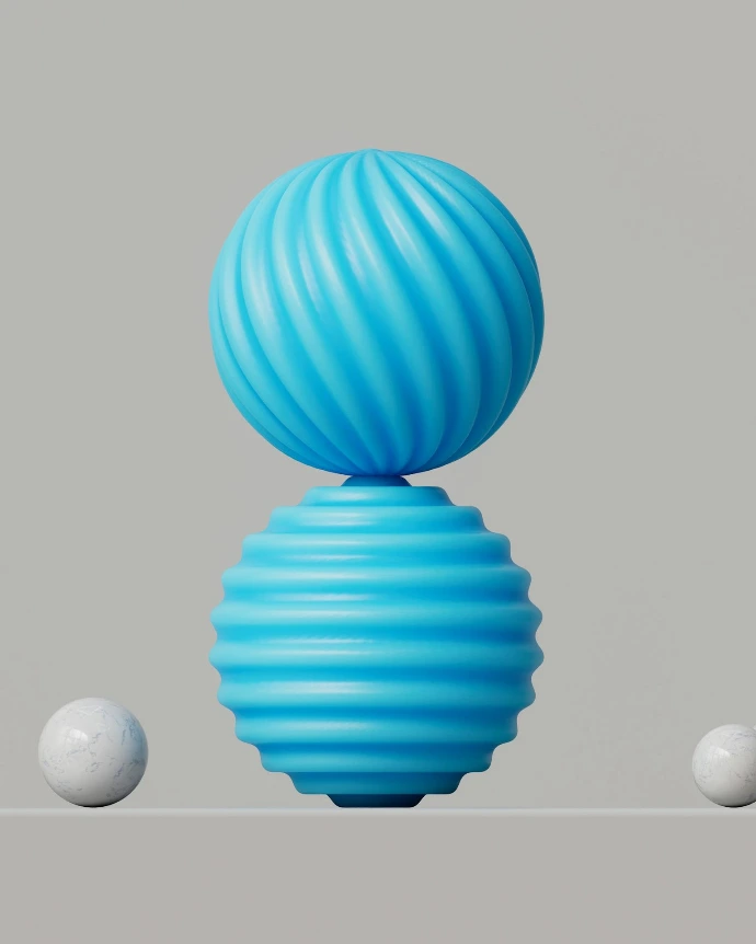 a blue vase sitting on top of a table next to three white balls